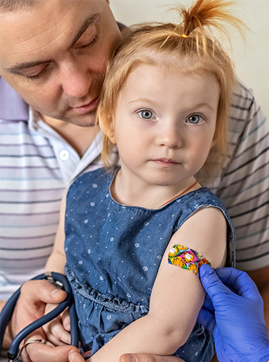 Child with a vaccination bandage during immunisation at Cranbourne West Medical Centre.